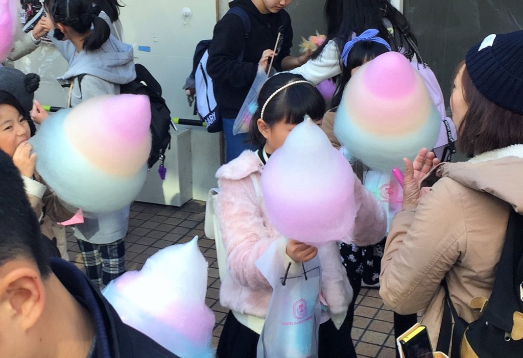 girls with cotton candy form Totti Candy Factory, Harajuku, Tokyo, Japan