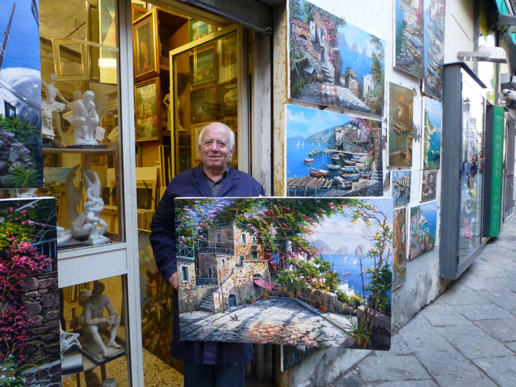 Painter holding his painting on San Cesareo in Sorrento, Italy